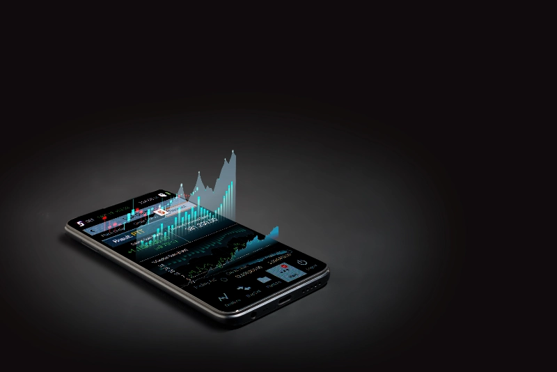 Teléfono inteligente sobre fondo oscuro proyectando un gráfico financiero digital en 3D que emerge de su pantalla.